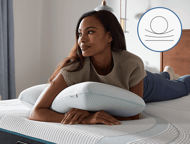 woman laying on tempurpedic comfort pillow with an icon demonstrating a classic shape