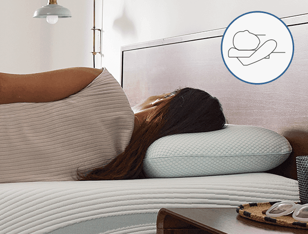 Woman laying on her back with TempurPedic Comfort Pillow