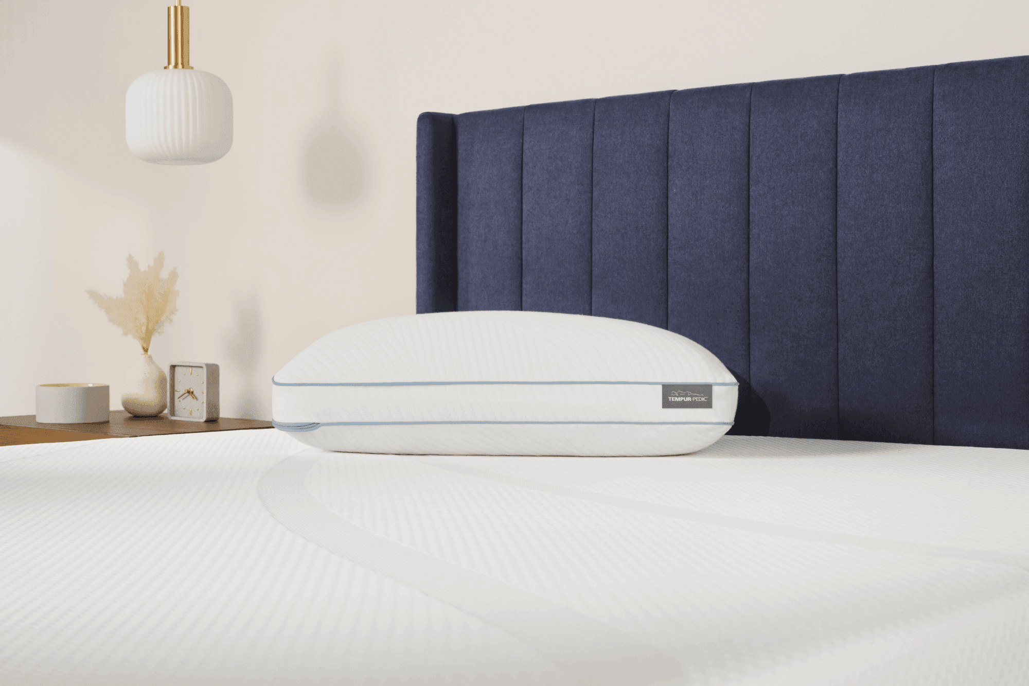 Tempur Cloud Hybrid Pillow laying on a Tempur Pedic mattress